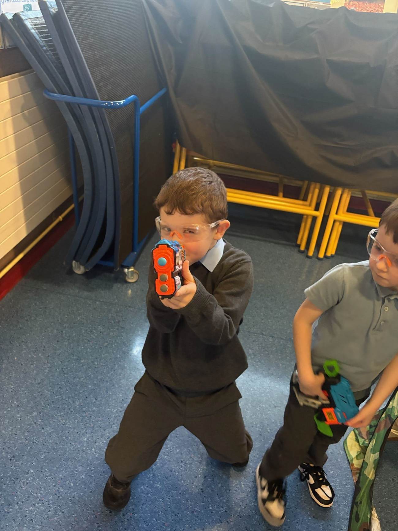 Child aiming a Nerf blaster during an Elevate Sports Nerf party