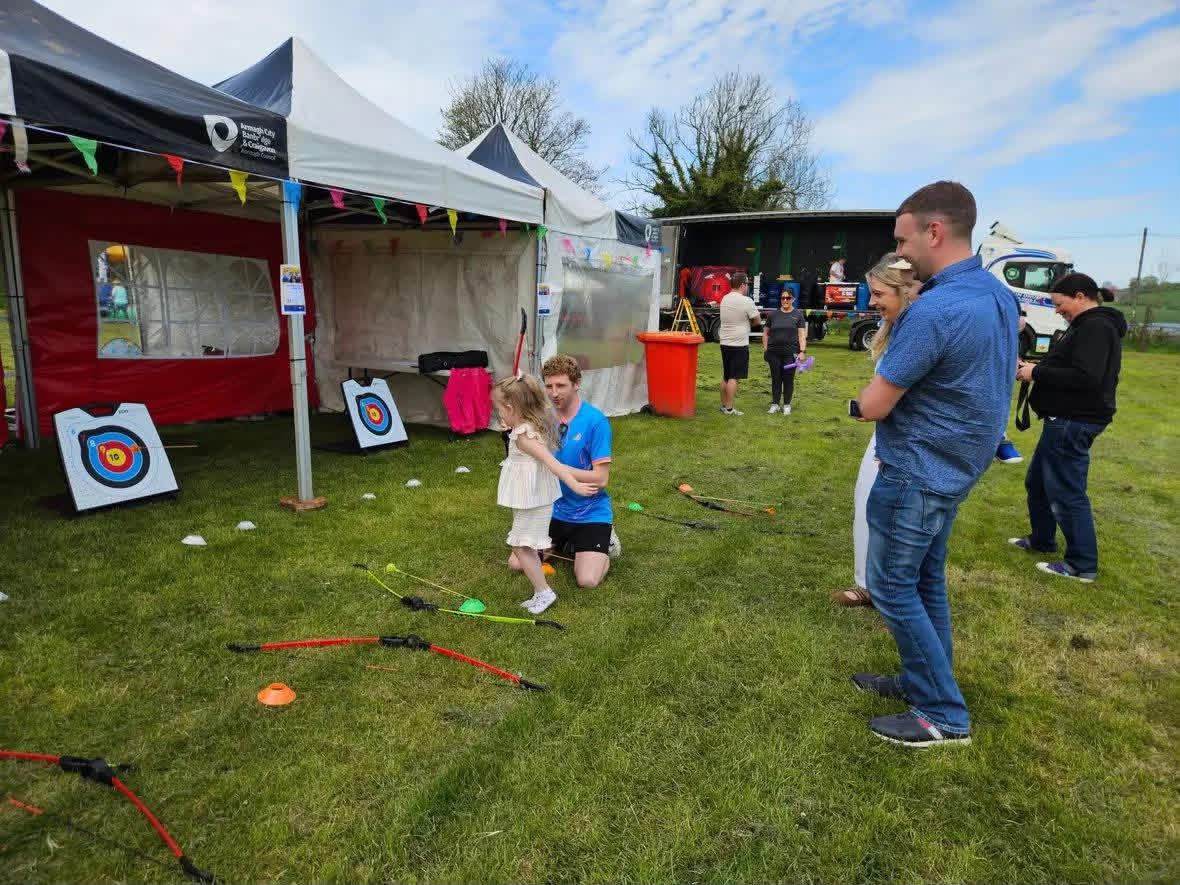 Children taking part in an archery activity at an Elevate Sports community event