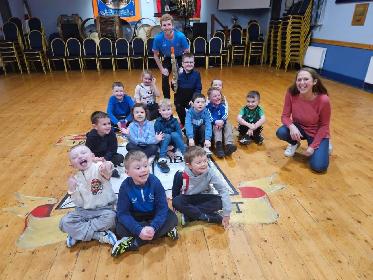 A large group of children with their coach during an Elevate Sports team building session