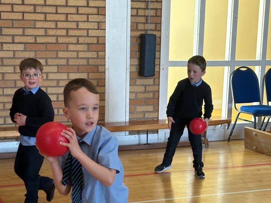 Children playing dodgeball during an after-school sports club